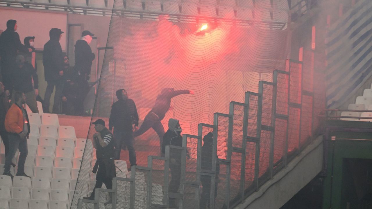 PAOK supporters throw burning flares from the stands priorto the UEFA Europa Conference League quarter-final second leg football match between Olympique de Marseille (OM) and PAOK Thessaloniki at the Velodrome Stadium in Marseille, southeastern France on April 7, 2022.