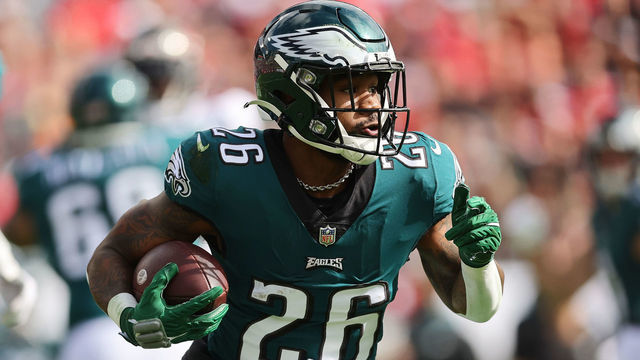 TAMPA, FLORIDA - JANUARY 16: Miles Sanders #26 of the Philadelphia Eagles runs with the ball against the Tampa Bay Buccaneers in the first half of the NFC Wild Card Playoff game at Raymond James Stadium on January 16, 2022 in Tampa, Florida.