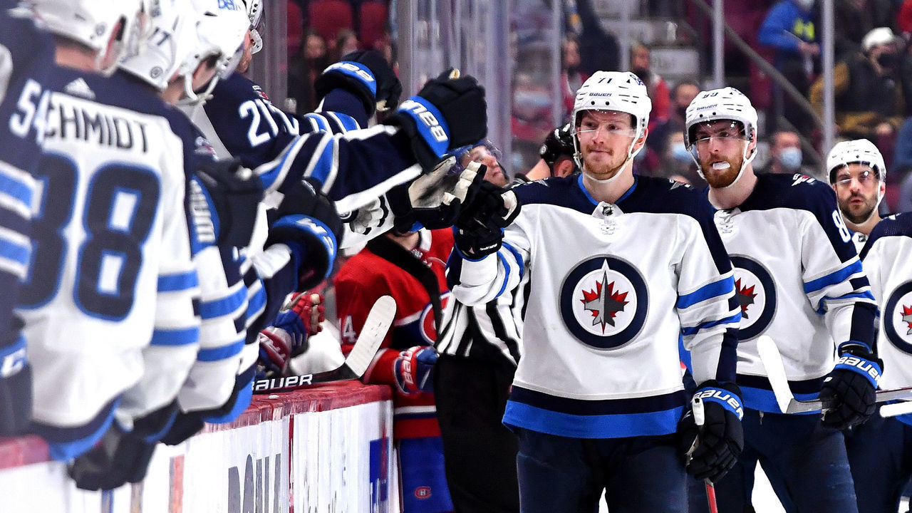 MONTREAL, QC - APRIL 11: Evgeny Svechnikov #71 of the Winnipeg Jets celebrates with the bench after scoring a goal against the Montreal Canadiens in the NHL game at the Bell Centre on April 11, 2022 in Montreal, Quebec, Canada.