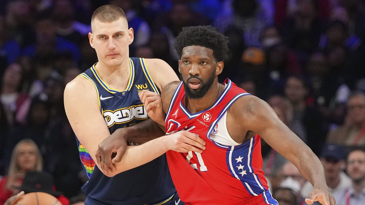 PHILADELPHIA, PA - MARCH 14: Nikola Jokic #15 of the Denver Nuggets guards Joel Embiid #21 of the Philadelphia 76ers at the Wells Fargo Center on March 14, 2022 in Philadelphia, Pennsylvania. The Nuggets defeated the 76ers 114-110.