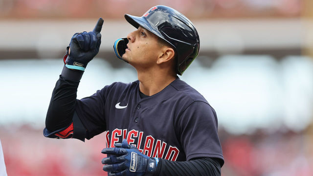 CINCINNATI, OHIO - APRIL 12: Andres Gimenez #0 of the Cleveland Guardians hits a RBI triple in the fourth inning against the Cincinnati Reds at Great American Ball Park on April 12, 2022 in Cincinnati, Ohio.
