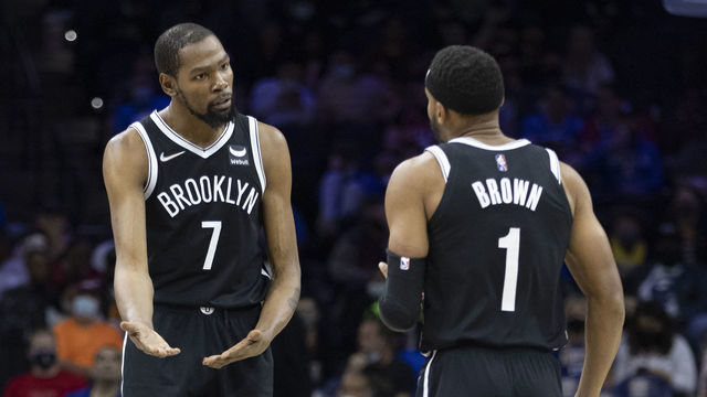 PHILADELPHIA, PA - OCTOBER 11: Kevin Durant #7 of the Brooklyn Nets talks to Bruce Brown #1 against the Philadelphia 76ers at the Wells Fargo Center on October 11, 2021 in Philadelphia, Pennsylvania.