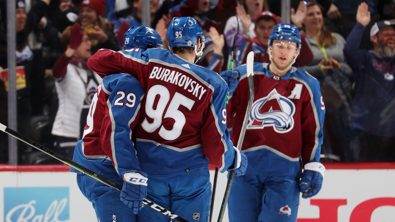 DENVER, COLORADO - APRIL 13: Andre Burakovsky #95 and Nathan MacKinnon #29 of the Colorado Avalanche celebrate a goal by Burakovsky against the Los Angeles Kings at Ball Arena on April 13, 2022 in Denver, Colorado.