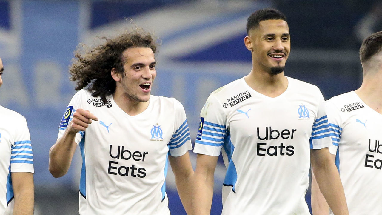 MARSEILLE, FRANCE - MARCH 20: Dimitri Payet, Matteo Guendouzi, William Saliba, Arkadiusz Milik of Marseille celebrate the victory following the Ligue 1 Uber Eats match between Olympique de Marseille (OM) and OGC Nice (OGCN) at Stade Velodrome on March 20, 2022 in Marseille, France.