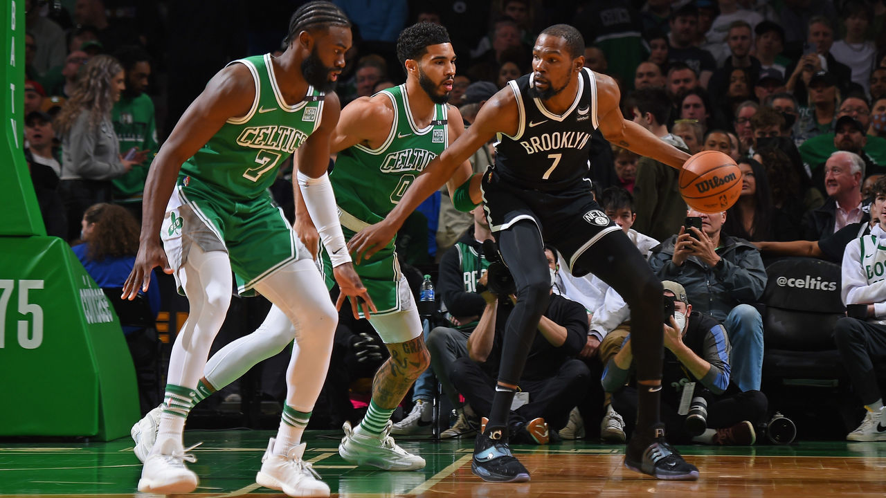 BOSTON, MA - MARCH 6: Jaylen Brown #7 and Jayson Tatum #0 of the Boston Celtics play defense on Kevin Durant #7 of the Brooklyn Nets during the game on March 6, 2022 at the TD Garden in Boston, Massachusetts. Mandatory Copyright Notice: Copyright 2022 NBAE