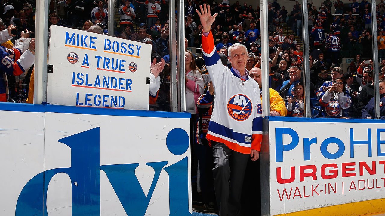 UNIONDALE, NY - JANUARY 29: Former New York Islander and Hall of Famer Mike Bossy waves to the crowd for Mike Bossy tribute night prior to a game between the New York Islanders and the Boston Bruins at Nassau Veterans Memorial Coliseum on January 29, 2015 in Uniondale, New York.