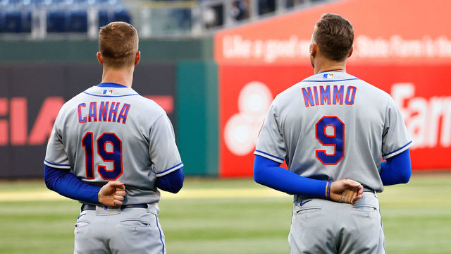 PHILADELPHIA, PA - APRIL 12: New York Mets left fielder Mark Canha (19), New York Mets center fielder Brandon Nimmo (9) and New York Mets center fielder Starling Marte (6) during the National Anthem prior to the Major League baseball game between the Philadelphia Phillies and the New York Mets on April 12, 2022 at Citizens Bank Park in Philadelphia, Pennsylvania.