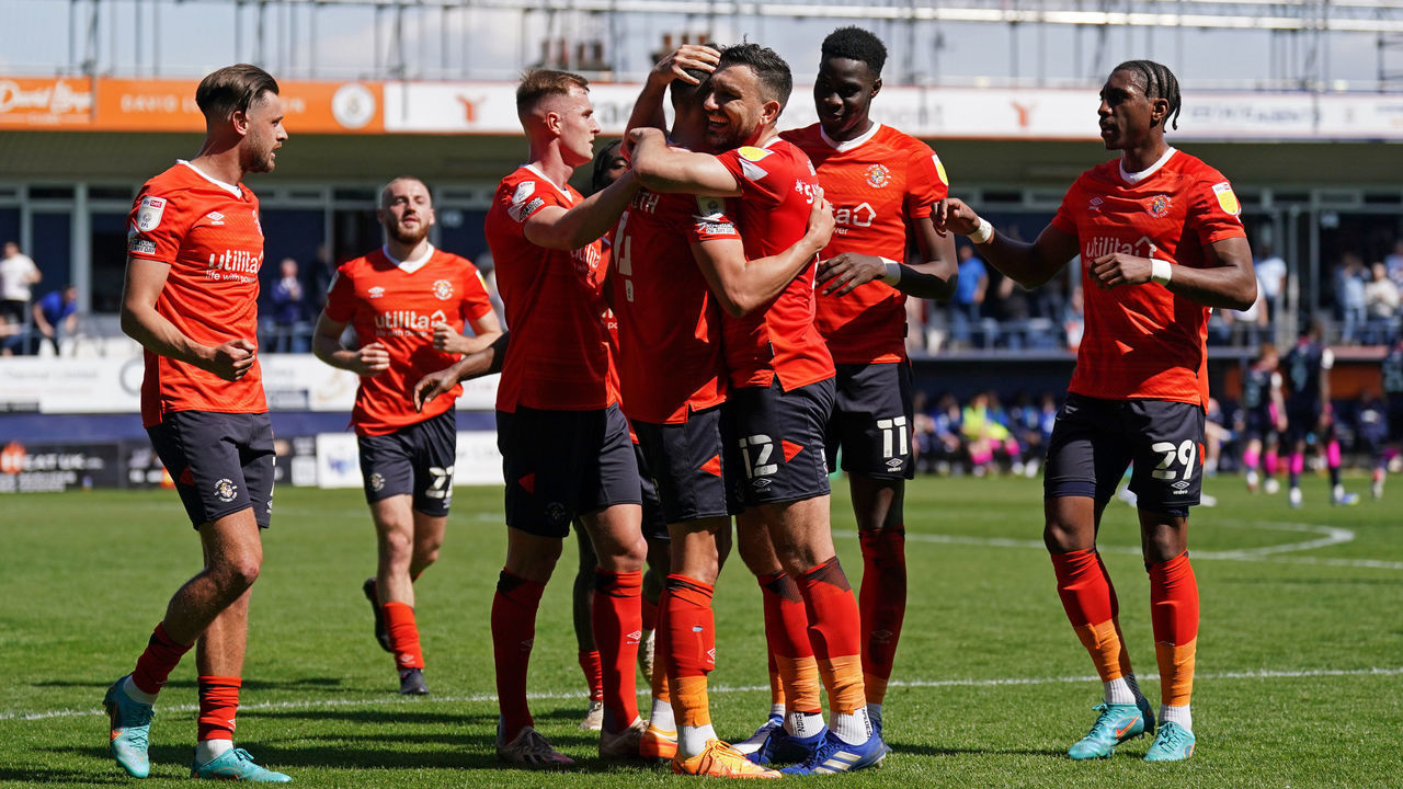 Luton Town's Kal Naismith (centre) celebrates with Robert Snodgrass after scoring their side's first goal of the game from the penalty spot during the Sky Bet Championship match at Kenilworth Road, Luton. Picture date: Friday April 15, 2022.