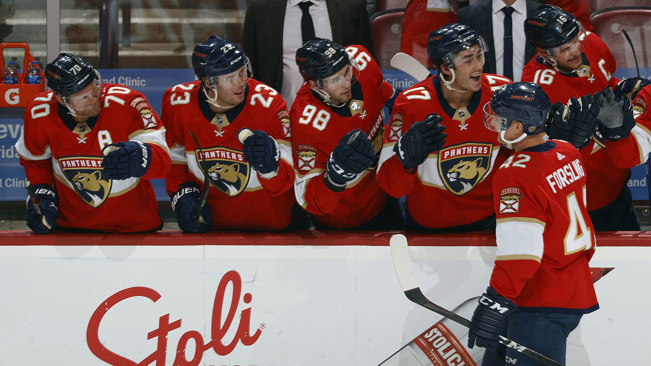 SUNRISE, FL - APRIL 15: Gustav Forsling #42 of the Florida Panthers skates by the bench and is congratulated by teammates after he scored a second period goal against the Winnipeg Jets at the FLA Live Arena on April 15, 2022 in Sunrise, Florida.