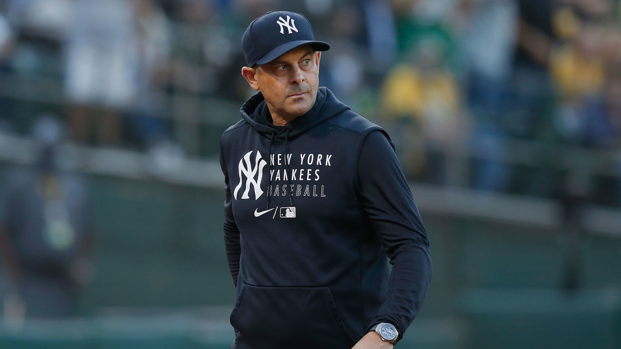 OAKLAND, CALIFORNIA - AUGUST 26: Manager Aaron Boone #17 of the New York Yankees looks on during the game against the Oakland Athletics at RingCentral Coliseum on August 26, 2021 in Oakland, California.