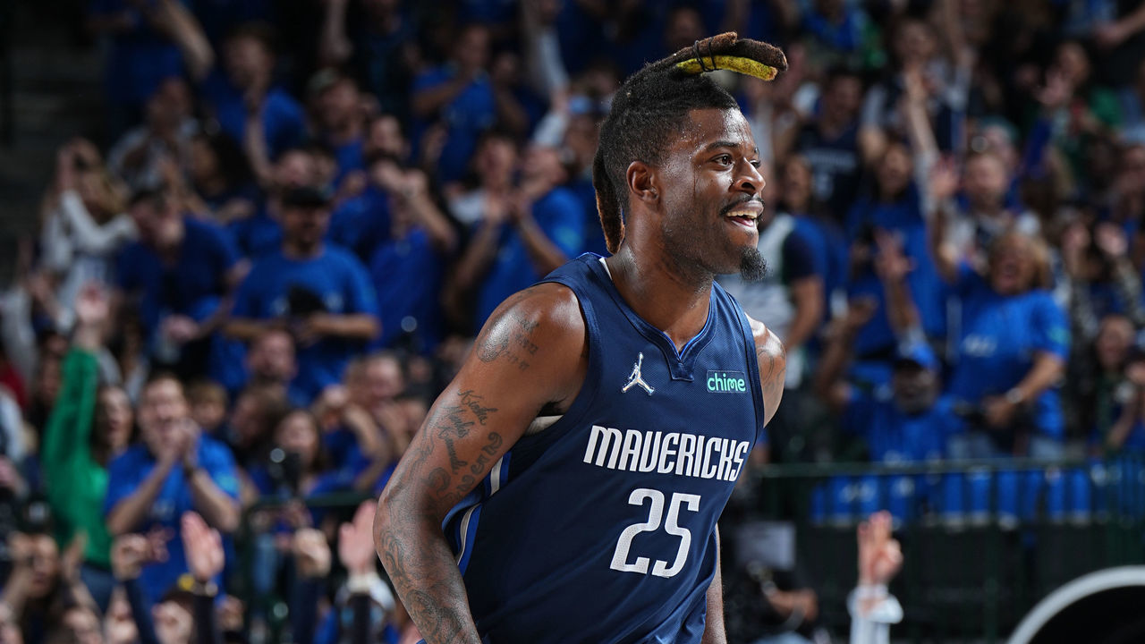 DALLAS, TX - APRIL 16: Reggie Bullock #25 of the Dallas Mavericks runs on to the court during the game against the Utah Jazz during Round 1 Game 1 of the 2022 NBA Playoffs on April 16, 2022 at the American Airlines Center in Dallas, Texas. Mandatory Copyright Notice: Copyright 2022 NBAE