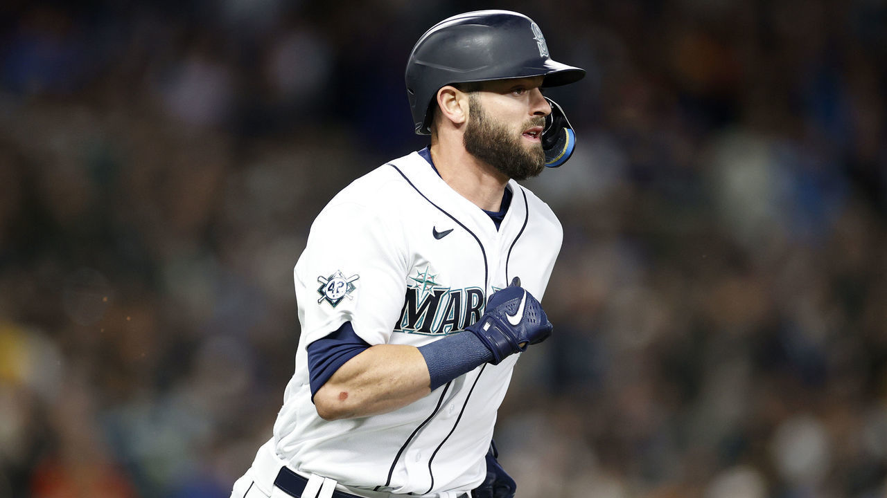 SEATTLE, WASHINGTON - APRIL 15: Mitch Haniger #17 of the Seattle Mariners runs to first base against the Houston Astros during the fourth inning at T-Mobile Park on April 15, 2022 in Seattle, Washington. All players are wearing the number 42 in honor of Jackie Robinson Day.