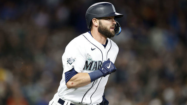 SEATTLE, WASHINGTON - APRIL 15: Mitch Haniger #17 of the Seattle Mariners runs to first base against the Houston Astros during the fourth inning at T-Mobile Park on April 15, 2022 in Seattle, Washington. All players are wearing the number 42 in honor of Jackie Robinson Day.