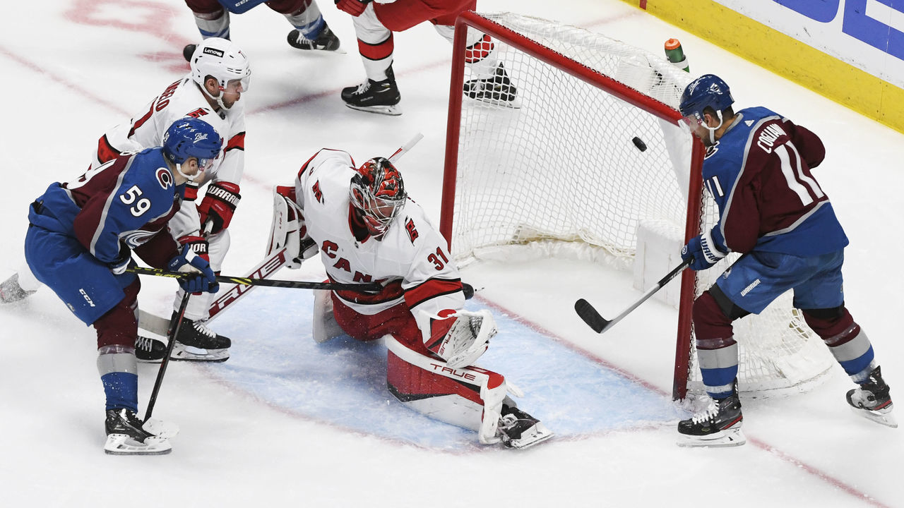 DENVER, CO - APRIL 16: Colorado Avalanche center Ben Meyers (59) scores his first NHL goal against Carolina Hurricanes goaltender Frederik Andersen (31) in the second period at Ball Arena April 16, 2022. "n"n