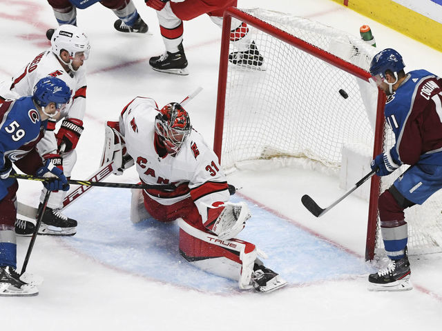 DENVER, CO - APRIL 16: Colorado Avalanche center Ben Meyers (59) scores his first NHL goal against Carolina Hurricanes goaltender Frederik Andersen (31) in the second period at Ball Arena April 16, 2022. "n"n
