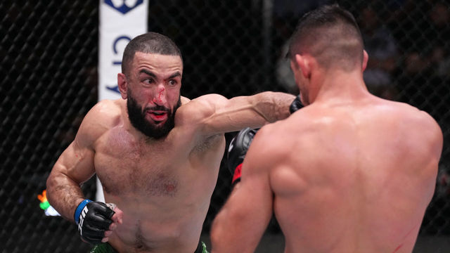 LAS VEGAS, NEVADA - APRIL 16: (L-R) Belal Muhammad punches Vicente Luque of Brazil in a welterweight fight during the UFC Fight Night event at UFC APEX on April 16, 2022 in Las Vegas, Nevada.