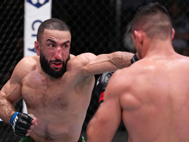 LAS VEGAS, NEVADA - APRIL 16: (L-R) Belal Muhammad punches Vicente Luque of Brazil in a welterweight fight during the UFC Fight Night event at UFC APEX on April 16, 2022 in Las Vegas, Nevada.