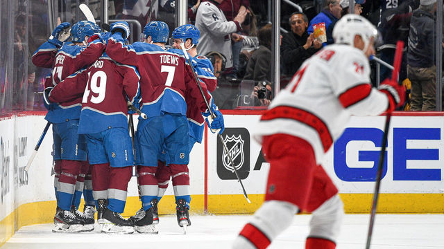 DENVER, COLORADO - APRIL 16: Colorado Avalanche players celebrate a first period J.T. Compher #37 goal against the Carolina Hurricanes at Ball Arena on April 16, 2022 in Denver, Colorado.