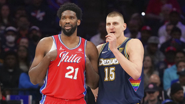 PHILADELPHIA, PA - MARCH 14: Joel Embiid #21 of the Philadelphia 76ers talks to Nikola Jokic #15 of the Denver Nuggets at the Wells Fargo Center on March 14, 2022 in Philadelphia, Pennsylvania. The Nuggets defeated the 76ers 114-110.