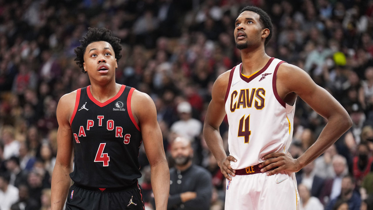 TORONTO, ON - MARCH 24: Scottie Barnes #4 of the Toronto Raptors and Evan Mobley #4 of the Cleveland Cavaliers look on in a break during the first half of their basketball game at the Scotiabank Arena on March 24, 2022 in Toronto, Ontario, Canada. NOTE TO USER: User expressly acknowledges and agrees that, by downloading and/or using this Photograph, user is consenting to the terms and conditions of the Getty Images License Agreement.