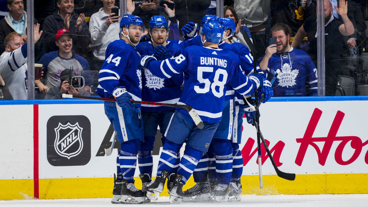 TORONTO, ON - APRIL 17: William Nylander #88 of the Toronto Maple Leafs celebrates his goal against the New York Islanders with teammates Morgan Rielly #44, Michael Bunting #58 and Mitch Marner #16 during the second period at the Scotiabank Arena on April 17, 2022 in Toronto, Ontario, Canada.