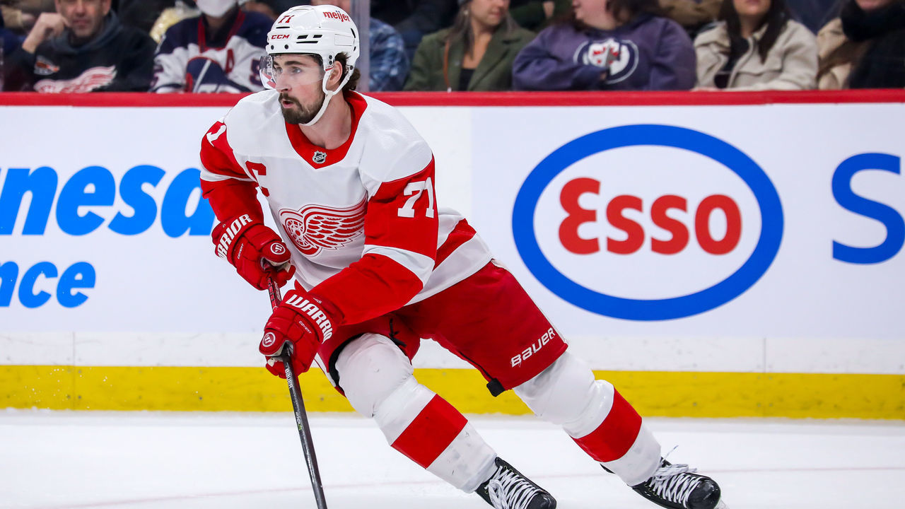 WINNIPEG, MB - APRIL 06: Dylan Larkin #71 of the Detroit Red Wings plays the puck during first period action against the Winnipeg Jets at Canada Life Centre on April 06, 2022 in Winnipeg, Manitoba, Canada.