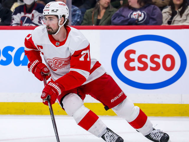 WINNIPEG, MB - APRIL 06: Dylan Larkin #71 of the Detroit Red Wings plays the puck during first period action against the Winnipeg Jets at Canada Life Centre on April 06, 2022 in Winnipeg, Manitoba, Canada.