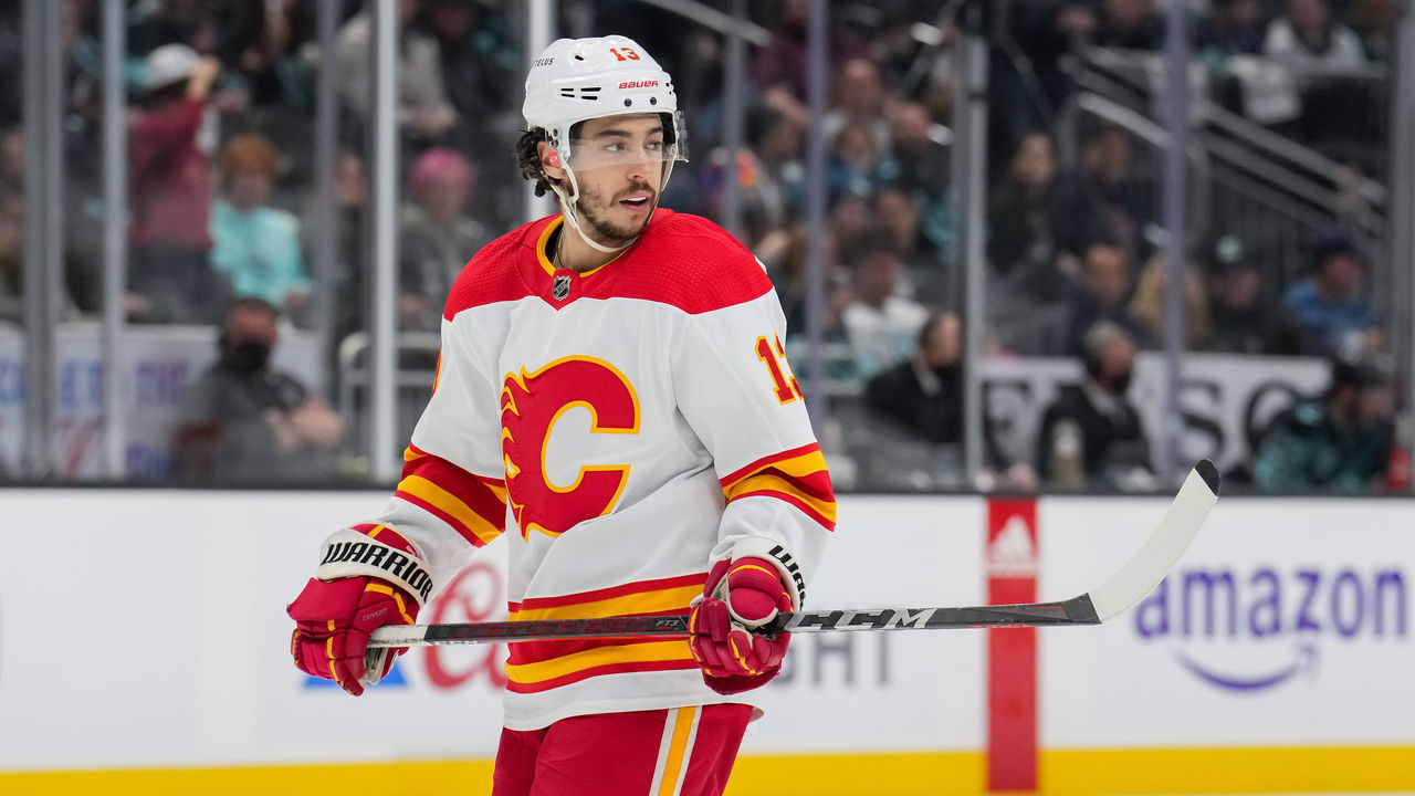 SEATTLE, WASHINGTON - APRIL 09: Johnny Gaudreau #13 of the Calgary Flames waits for a face-off against the Seattle Kraken during the third period of a game at Climate Pledge Arena on April 09, 2022 in Seattle, Washington.