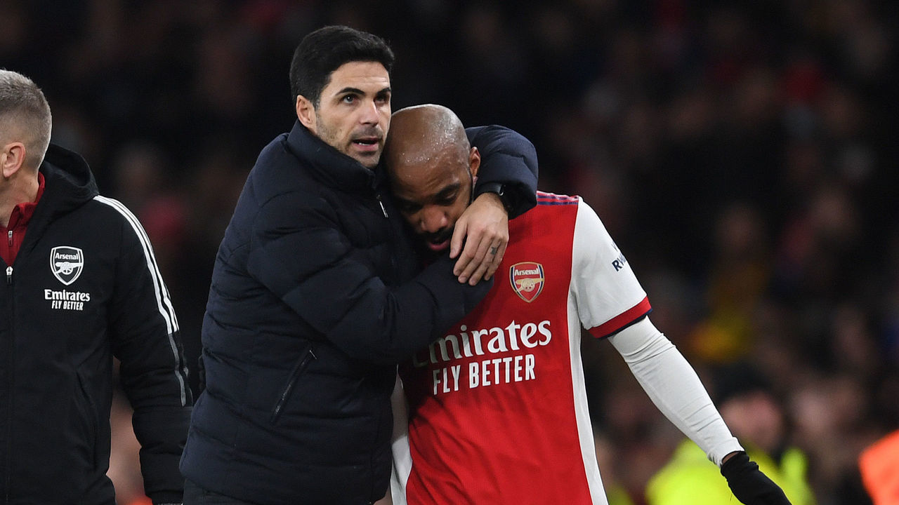 LONDON, ENGLAND - DECEMBER 15: Arsenal manager Mikel Arteta hugs Alex Lacazette after his substitution during the Premier League match between Arsenal and West Ham United at Emirates Stadium on December 15, 2021 in London, England.