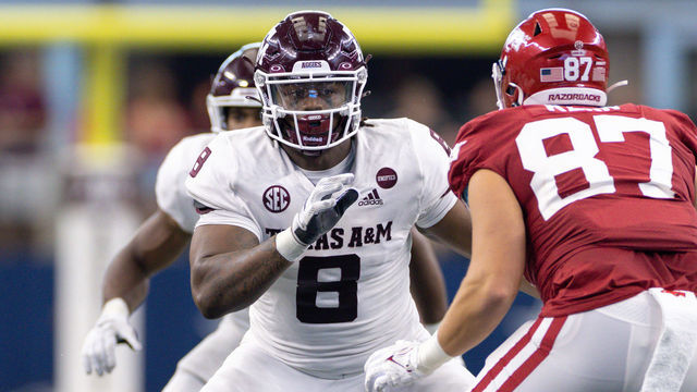 ARLINGTON, TX - SEPTEMBER 25: Texas A&M Aggies defensive lineman DeMarvin Leal (#9) tries to get past Arkansas Razorbacks tight end Blake Kern (#87) during the Southwest Classic college football game between the Texas A&M Aggies and Arkansas Razorbacks on September 25, 2021 at AT&T Stadium in Arlington, TX.