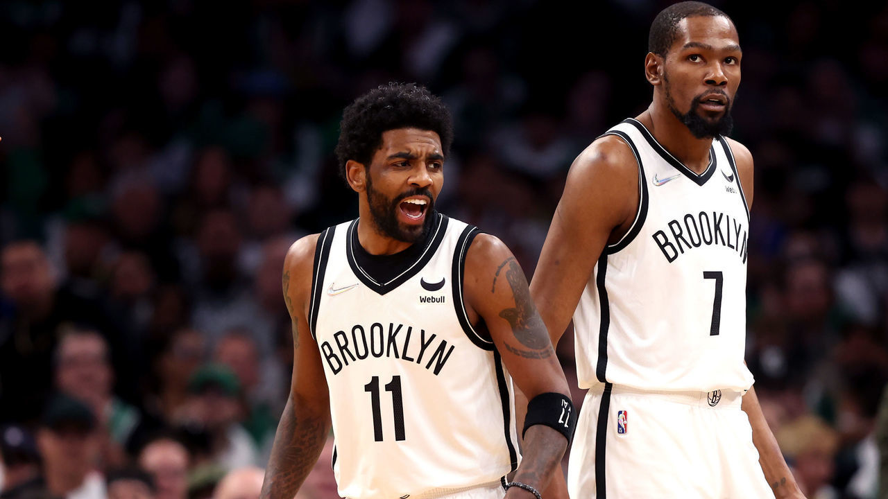 BOSTON, MASSACHUSETTS - APRIL 17: Kyrie Irving #11 of the Brooklyn Nets and Kevin Durant #7 look on during the first quarter of Round 1 Game 1 of the 2022 NBA Eastern Conference Playoffs against the Boston Celtics at TD Garden on April 17, 2022 in Boston, Massachusetts.