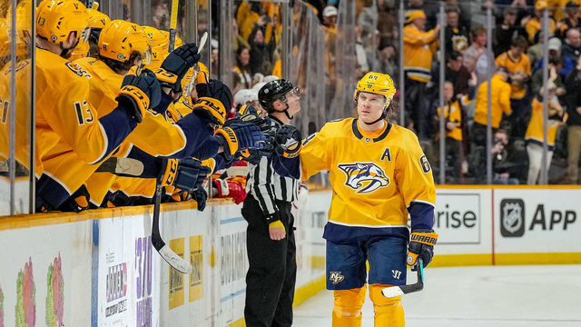 NASHVILLE, TN - APRIL 19: Mikael Granlund #64 of the Nashville Predators celebrates his game winning shootout goal against the Calgary Flames during an NHL game at Bridgestone Arena on April 19, 2022 in Nashville, Tennessee.