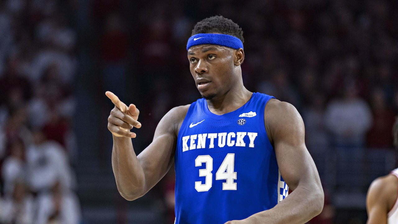 FAYETTEVILLE, ARKANSAS - FEBRUARY 26: Oscar Tshiebwe #34 of the Kentucky Wildcats points to the bench during a game against the Arkansas Razorbacks at Bud Walton Arena on February 26, 2022 in Fayetteville, Arkansas. The Razorbacks defeated the Wildcats 75-73.
