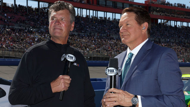 FONTANA, CALIFORNIA - FEBRUARY 27: NASCAR Fox Sports broadcasters Michael Waltrip (L) and Chris Myers stand on the grid prior to the NASCAR Cup Series Wise Power 400 at Auto Club Speedway on February 27, 2022 in Fontana, California.