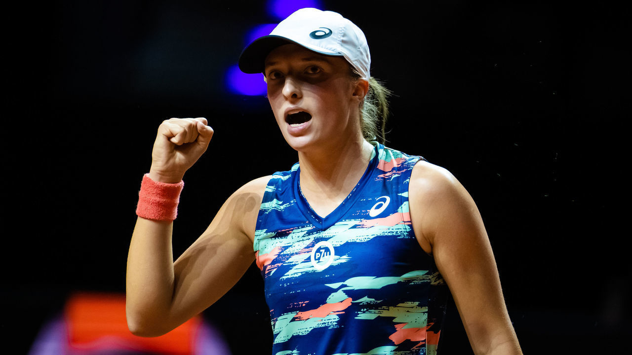 STUTTGART, GERMANY - APRIL 22: Iga Swiatek of Poland in action against Emma Raducanu of Great Britain during her quarter-final match on Day 5 of the Porsche Tennis Grand Prix Stuttgart 2022 at Porsche Arena on April 22, 2022 in Stuttgart, Germany
