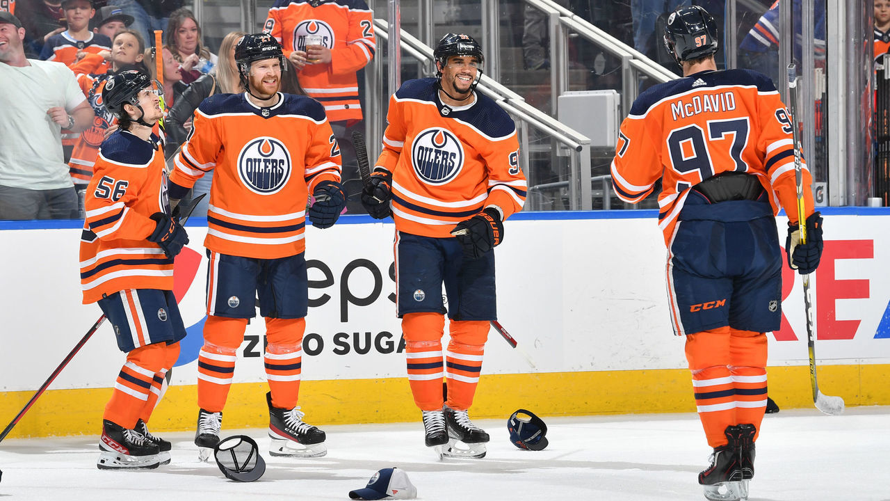 EDMONTON, AB - APRIL 22: Evander Kane #91, Kailer Yamamoto #56, Brett Kulak #27, and Connor McDavid #97 of the Edmonton Oilers celebrates after scoring his third goal of the game against the Colorado Avalanche on April 22, 2022 at Rogers Place in Edmonton, Alberta, Canada.