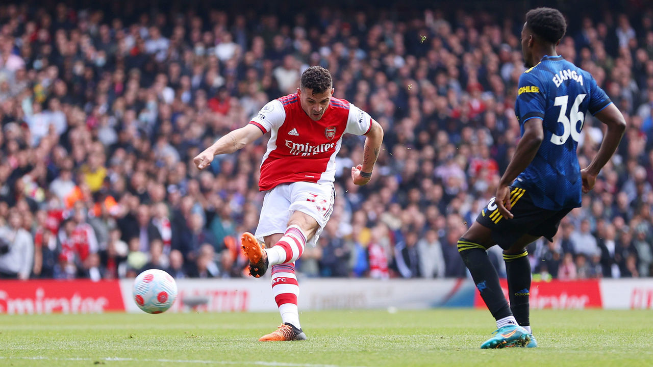 LONDON, ENGLAND - APRIL 23: Granit Xhaka of Arsenal scores their side's third goal during the Premier League match between Arsenal and Manchester United at Emirates Stadium on April 23, 2022 in London, England.