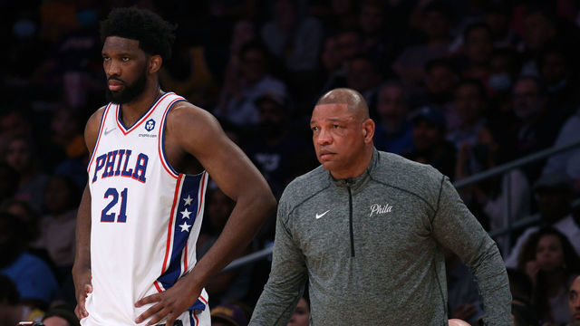 LOS ANGELES, CALIFORNIA - MARCH 23: Joel Embiid #21 and Doc Rivers watch play from the sidelines during the first half against the Los Angeles Lakers at Crypto.com Arena on March 23, 2022 in Los Angeles, California. NOTE TO USER: User expressly acknowledges and agrees that, by downloading and/or using this Photograph, user is consenting to the terms and conditions of the Getty Images License Agreement. Mandatory Copyright Notice: Copyright 2022 NBAE