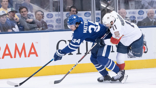 TORONTO, ON - MARCH 25: Florida Panthers Left Wing Jonathan Huberdeau (11) skates against Toronto Maple Leafs Center Auston Matthews (34) during the first period of the NHL regular season game between the Florida Panthers and the Toronto Maple Leafs on March 25, 2019, at Scotiabank Arena in Toronto, ON, Canada.