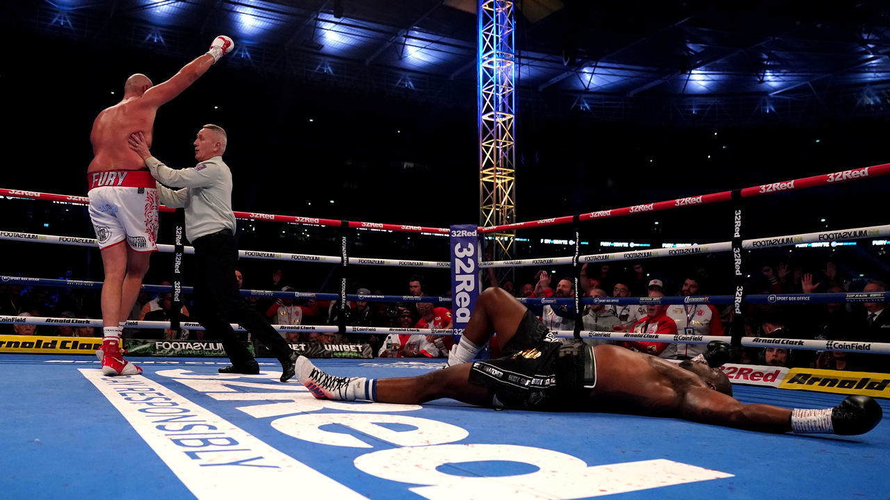 Tyson Fury celebrates after knocking down Dillian Whyte during the WBC heavyweight title fight at Wembley Stadium, London. Picture date: Saturday April 23, 2022.
