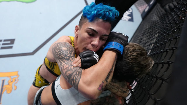 LAS VEGAS, NEVADA - APRIL 23: (L-R) Jessica Andrade of Brazil secures a choke submission against Amanda Lemos of Brazil in a strawweight fight during the UFC Fight Night event at UFC APEX on April 23, 2022 in Las Vegas, Nevada.