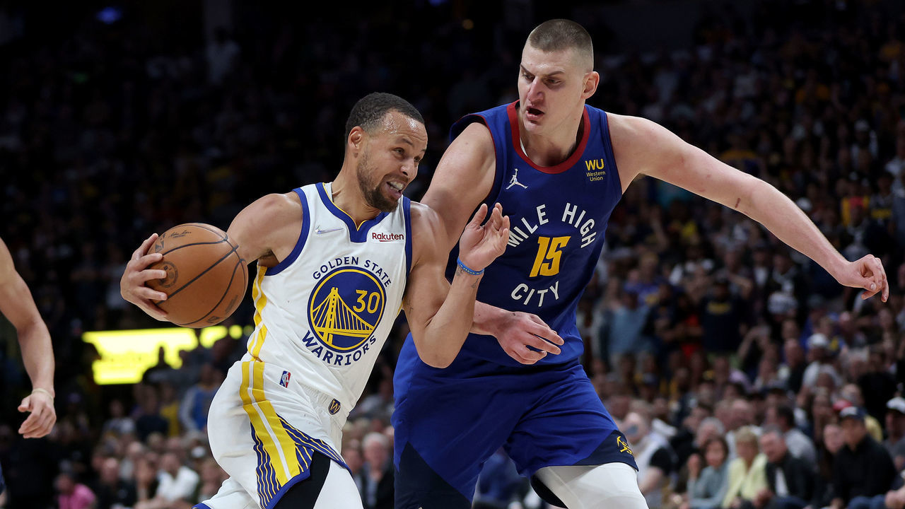 DENVER, COLORADO - APRIL 21: Stephen Curry #30 of the Golden State Warriors drives against Nikola Jokic #15 of the Denver Nuggets in the fourth quarter during Game Three of the Western Conference First Round NBA Playoffs at Ball Arena on April 21, 2022 in Denver, Colorado. NOTE TO USER: User expressly acknowledges and agrees that, by downloading and/or using this photograph, User is consenting to the terms and conditions of the Getty Images License Agreement.