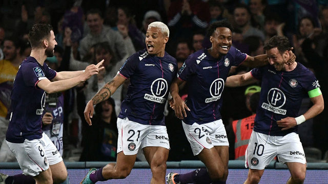 Toulouse's Belgian midfielder Brecht Dejaegere (R) celebrates with (fromL) Toulouse's Toulouse's Dutch midfielder Branco van den Boomen, Toulouse's Brazilian forward Rafael Rogerio Da Silva and Toulouse's French defender Anthony Rouault after scoring his team's first goal during the French L2 football match between Toulouse (TFC) and Chamois Niortais FC (Niort) at Le Stadium in Toulouse, south-western France, on April 25, 2022.