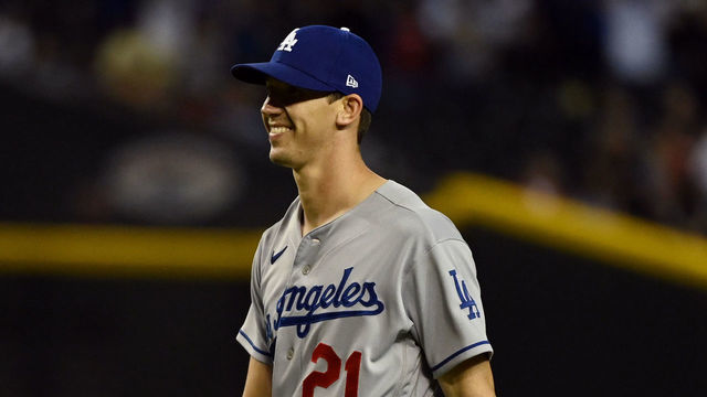 PHOENIX, ARIZONA - APRIL 25: Walker Buehler #21 of the Los Angeles Dodgers celebrates a 4-0 win against the Arizona Diamondbacks at Chase Field on April 25, 2022 in Phoenix, Arizona.