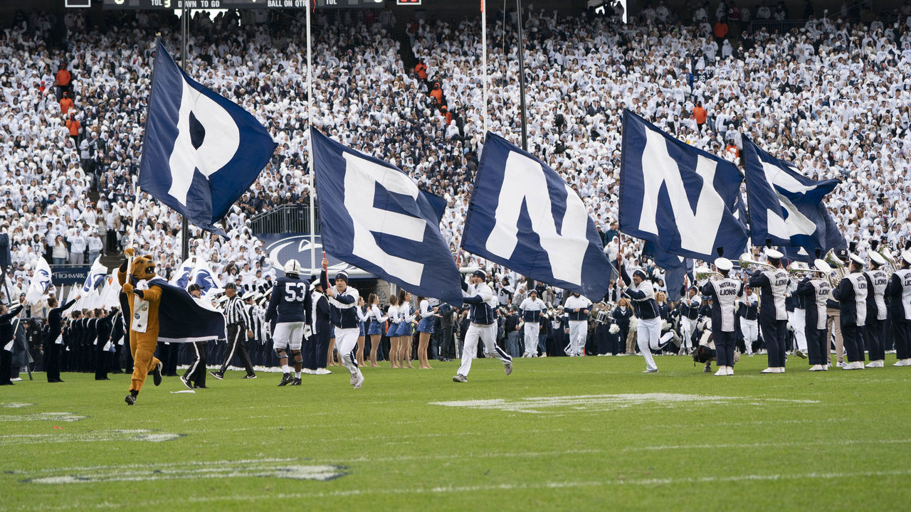 UNIVERSITY PARK, PA - NOVEMBER 13: The Penn State Nittany Lion Mascot leads the team onto the field prior to the College Football game between the Michigan Wolverines and the Penn State Nittany Lions on November 13, 2021, at Beaver Stadium in University Park, PA.