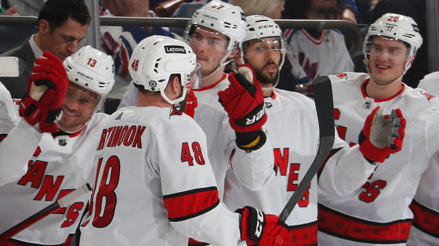 NEW YORK, NY - APRIL 26: Jordan Martinook #48 of the Carolina Hurricanes celebrates with teammates after scoring a goal in the second period against the New York Rangers at Madison Square Garden on April 26, 2022 in New York City.