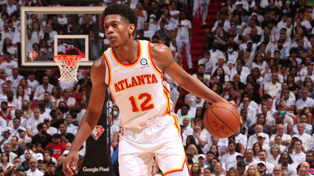 MIAMI, FL - APRIL 26: De'Andre Hunter #12 of the Atlanta Hawks dribbles the ball during the game against the Miami Heat during Round 1 Game 5 of the 2022 NBA Playoffs on April 26, 2022 at FTX Arena in Miami, Florida. Mandatory Copyright Notice: Copyright 2022 NBAE