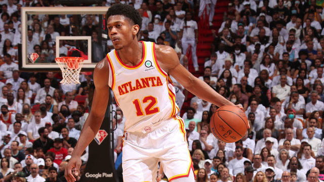 MIAMI, FL - APRIL 26: De'Andre Hunter #12 of the Atlanta Hawks dribbles the ball during the game against the Miami Heat during Round 1 Game 5 of the 2022 NBA Playoffs on April 26, 2022 at FTX Arena in Miami, Florida. Mandatory Copyright Notice: Copyright 2022 NBAE