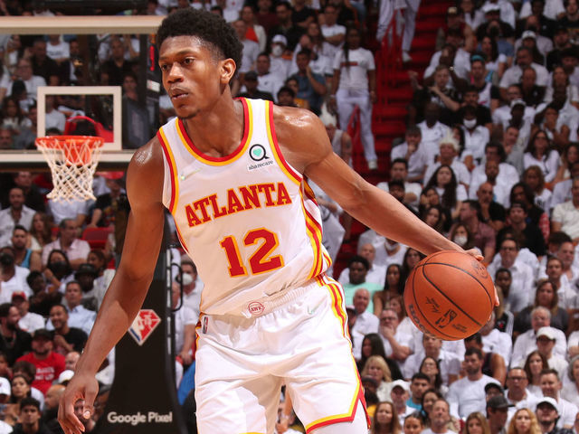 MIAMI, FL - APRIL 26: De'Andre Hunter #12 of the Atlanta Hawks dribbles the ball during the game against the Miami Heat during Round 1 Game 5 of the 2022 NBA Playoffs on April 26, 2022 at FTX Arena in Miami, Florida. Mandatory Copyright Notice: Copyright 2022 NBAE