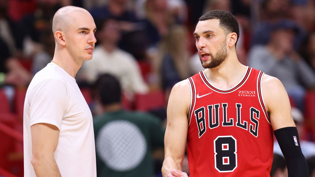 MIAMI, FLORIDA - FEBRUARY 28: Zach LaVine #8 of the Chicago Bulls talks with Alex Caruso #6 against the Miami Heat at FTX Arena on February 28, 2022 in Miami, Florida.